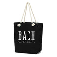 Load image into Gallery viewer, Black tote bag with 'BACH crew' text and rope handles on a white background. Inside zipper pocket. bagNook.com
